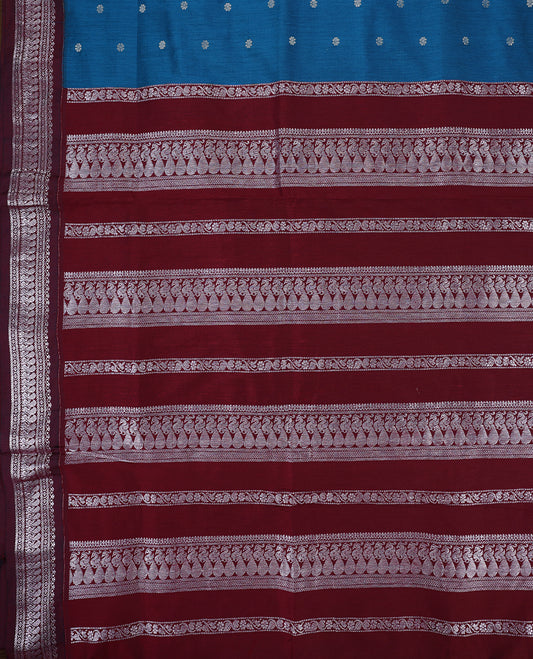 Blue colour mixed Kalyani cotton saree featuring Silver zari flower motifs throughout the body, paired with a Maroon colour traditional border and pallu, with matching blouse