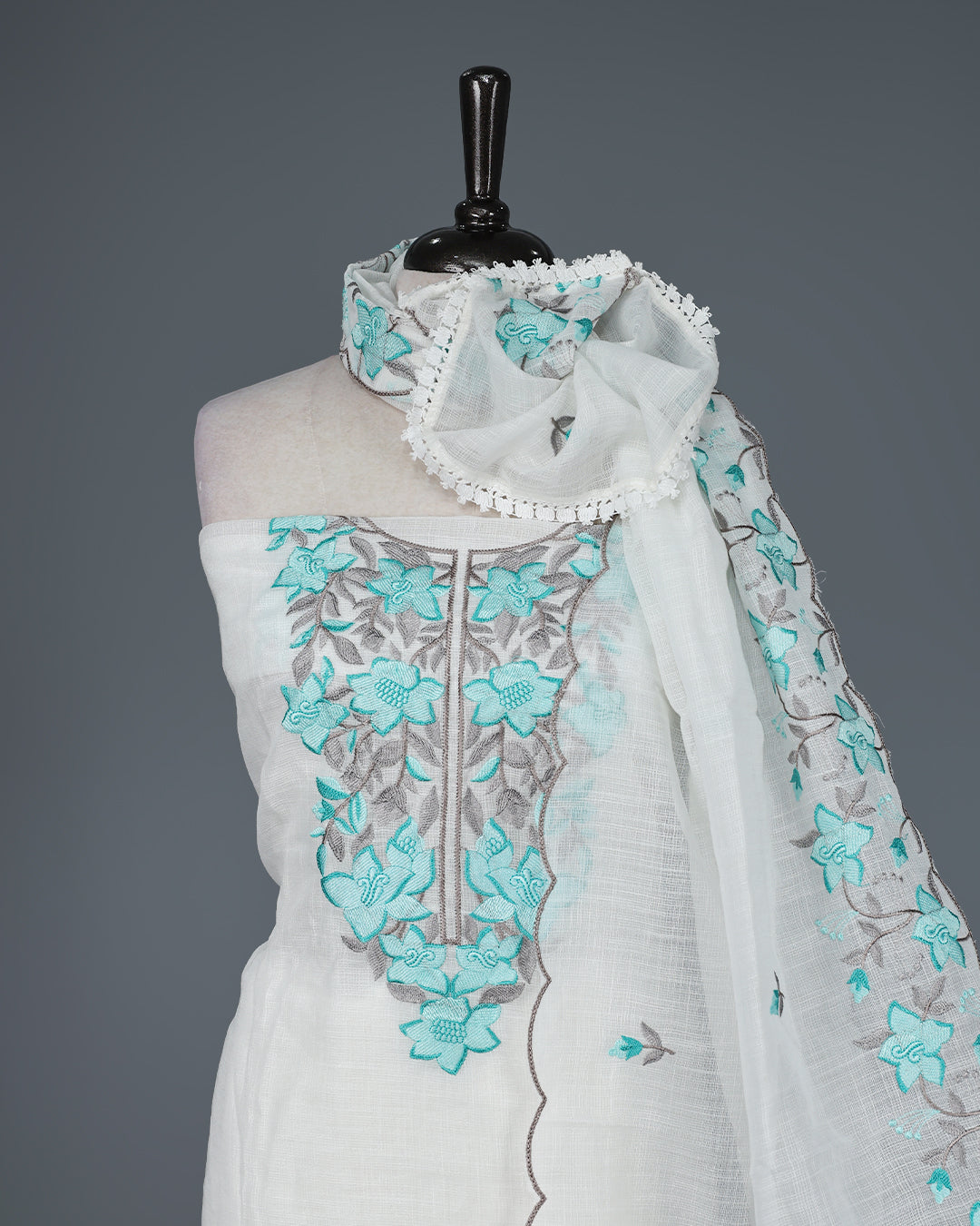 Off White Kotta Net Salwar Material featuring elegant aqua floral thread embroidery on yoke, paired with a matching bottom and an embroidered dupatta.