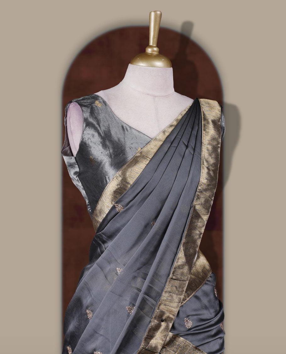 Gray colour Dhavani set featuring a Gray colour skirt with contrast Gold colour border with rich gold zari pattern, paired with a Matching dupatta detailed with Gold motifs.