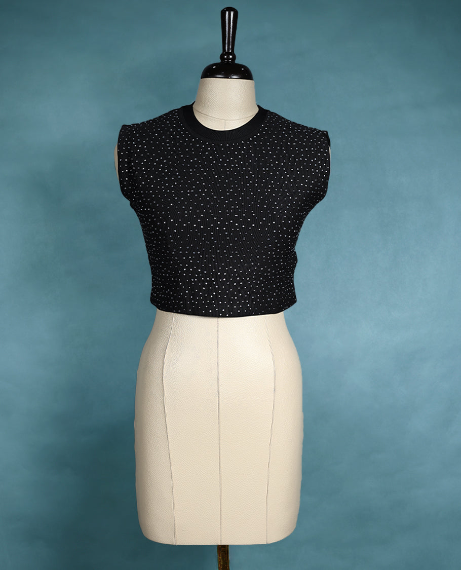 Black colour sleeveless crop top featuring a ribbed crew neck and all over stud embellishments, offering a chic and edgy look