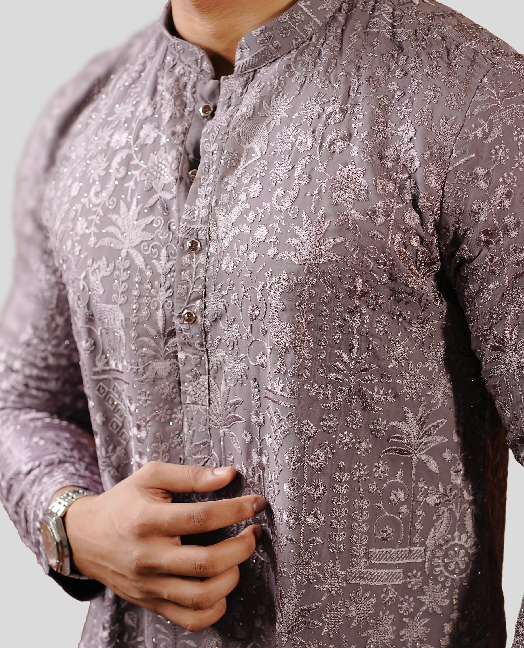 Dusty lavender colour men's kurta featuring elegant thread and sequins work on the body, complemented by full sleeves for a refined and festive look.