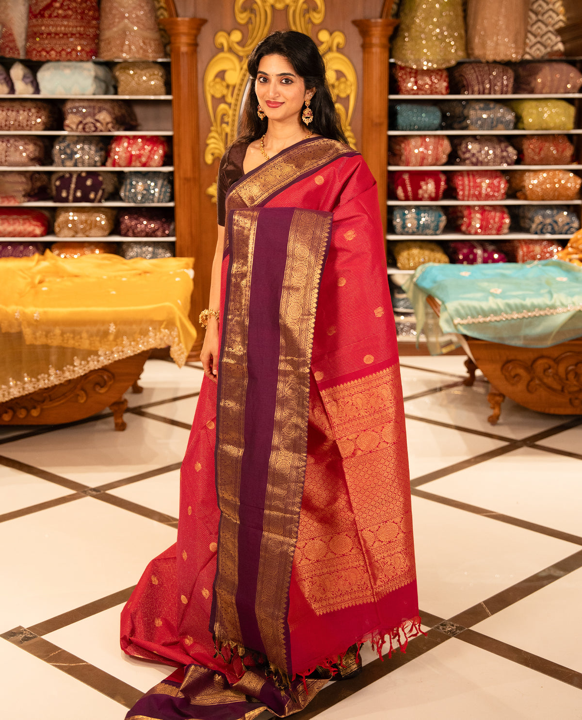 Magenta with Purple Chettinad cotton saree featuring Gold zari strips with peacock motifs on body, complemented by contrast colour border with zari design & grand pallu, comes with matching blouse piece.