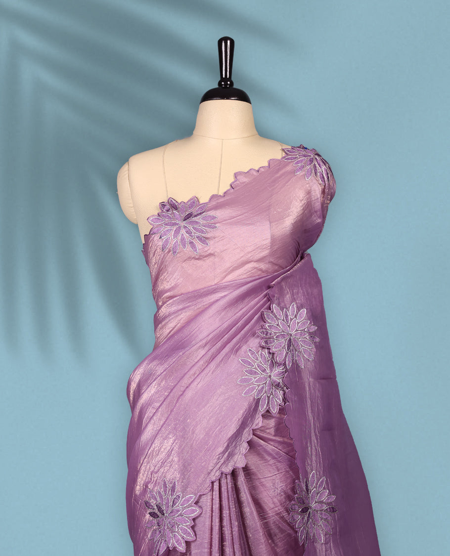 Pastel Purple colour crush soft silk saree adorned with bold floral thread embroidery on the body and scallop edged borders, Paired with a matching blouse for a complete look.