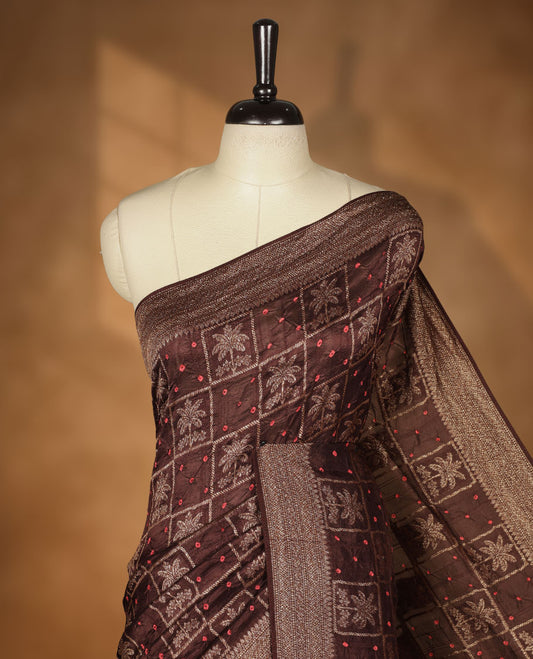 Dark Brown colour Banarasi Bandhani silk saree featuring with intricate Banarasi motifs on body, complemented by antique zari woven border and grand pallu, paired with matching  blouse