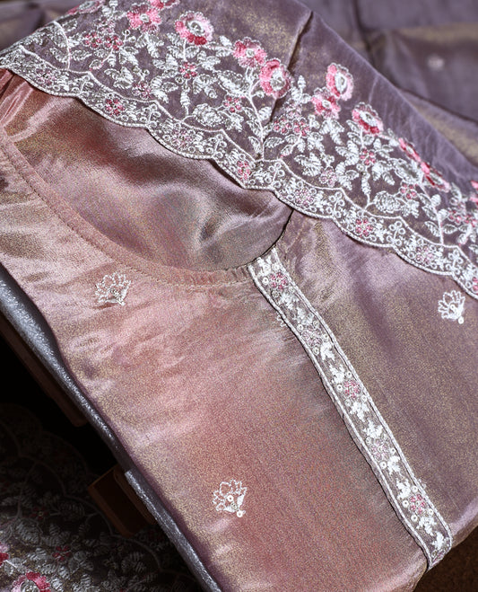 Mauve colour churidhar material with a soft sheen, adorned with pink and white floral lace embroidery & Comes with a plain matching bottom and dupatta.