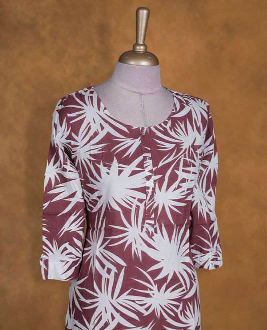 Mauve and white colour kurti with White floral prints, knee length design, styled with a round neckline and a sleeve .