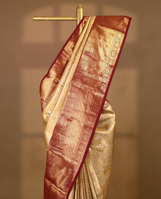 Gold colour tissue brocade saree with gold and silver zari kodi pattern on body, gold zari traditional pattern work Deep Maroon border, rich matching pallu with Antique zari motifs, paired with matching blouse.