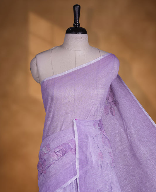Lavender colour pure linen saree featuring Floral print pattern across body, silver thin border finished with matching blouse.