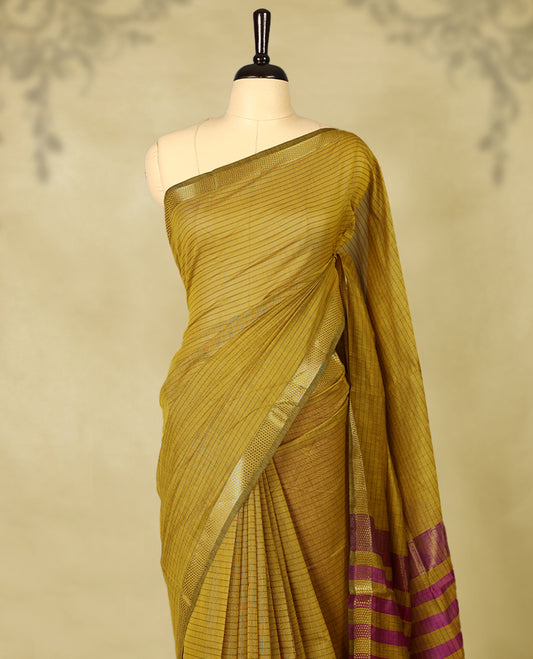 Mustard colour chanderi cotton saree with fine striped body, mangalgiri border, grand pallu featuring magenta and gold zari stripes, with matching blouse.