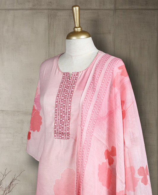Pastel pink colour salwar from TWARA, featuring a embroidered neck with peach colour bold floral thread work on the top, paired with a matching bottom and an elegant dupatta.