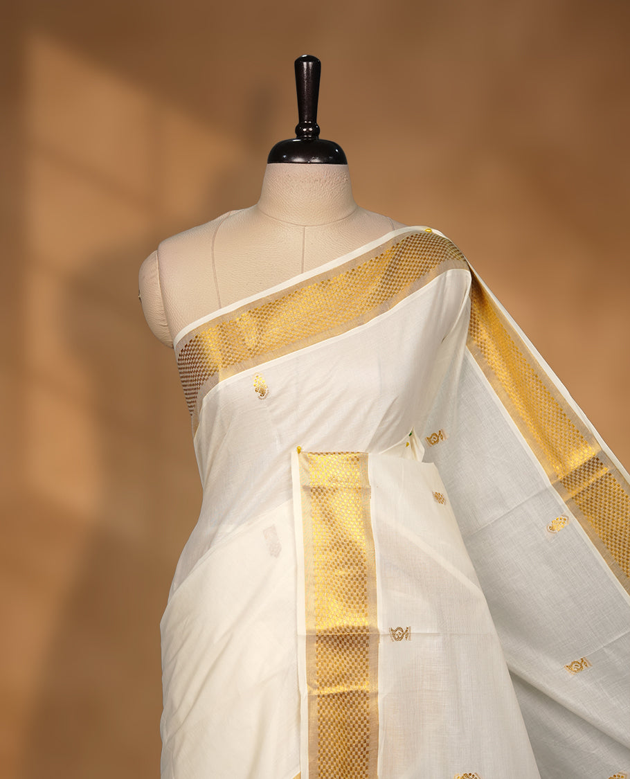 Elegant White colour cotton Kerala saree with gold zari buttas, broad kasavu border, and richly woven traditional pallu, paired with a matching blouse