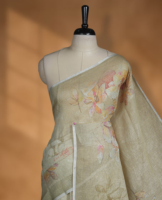 Khaki colour pure linen saree featuring Floral print pattern across body, silver thin border finished with matching blouse.