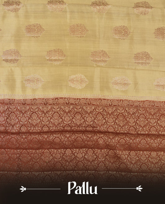 Cream Beige Colour Banaras Soft Silk Saree with Gold Zari Mandala Oval Buttas, Intricate Multi-Layered Floral and Foliate Pallu Border, Grand Pallu with Ornate Peacock Motifs in Burgundy and Gold Tones, and Matching Rust Orange Blouse.