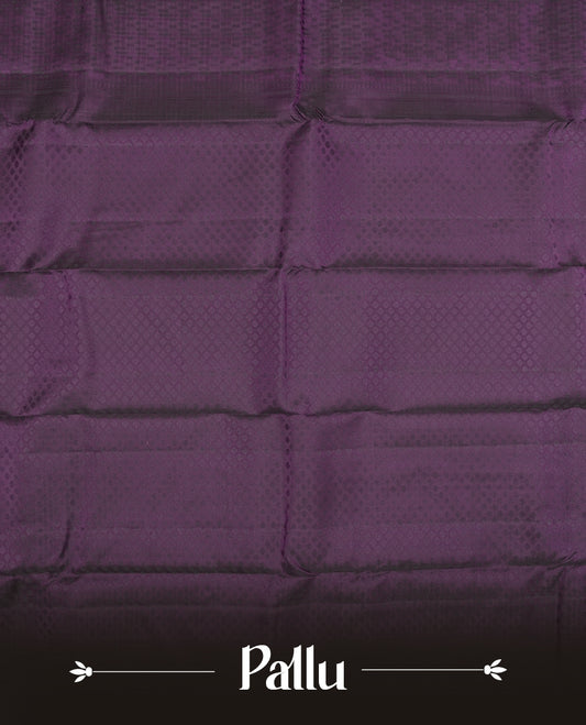 Deep violet colour semi soft silk saree featuring a self coloured textured patterned body, complemented by self coloured motifs on pallu & border and a matching blouse piece.