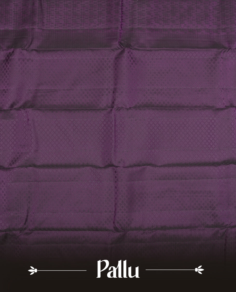 Deep violet colour semi soft silk saree featuring a self coloured textured patterned body, complemented by self coloured motifs on pallu & border and a matching blouse piece.