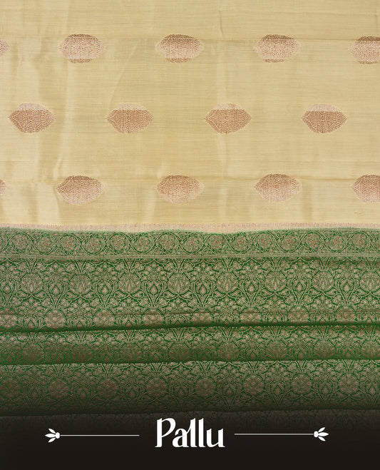 Golden Yellow Colour Banaras Soft Silk Saree with Gold Zari Textured Oval Buttas, Simple Decorative Pallu Border, Pallu with Ornate Floral and Foliate Motifs in Green and Gold Tones, and Matching Forest Green Blouse.