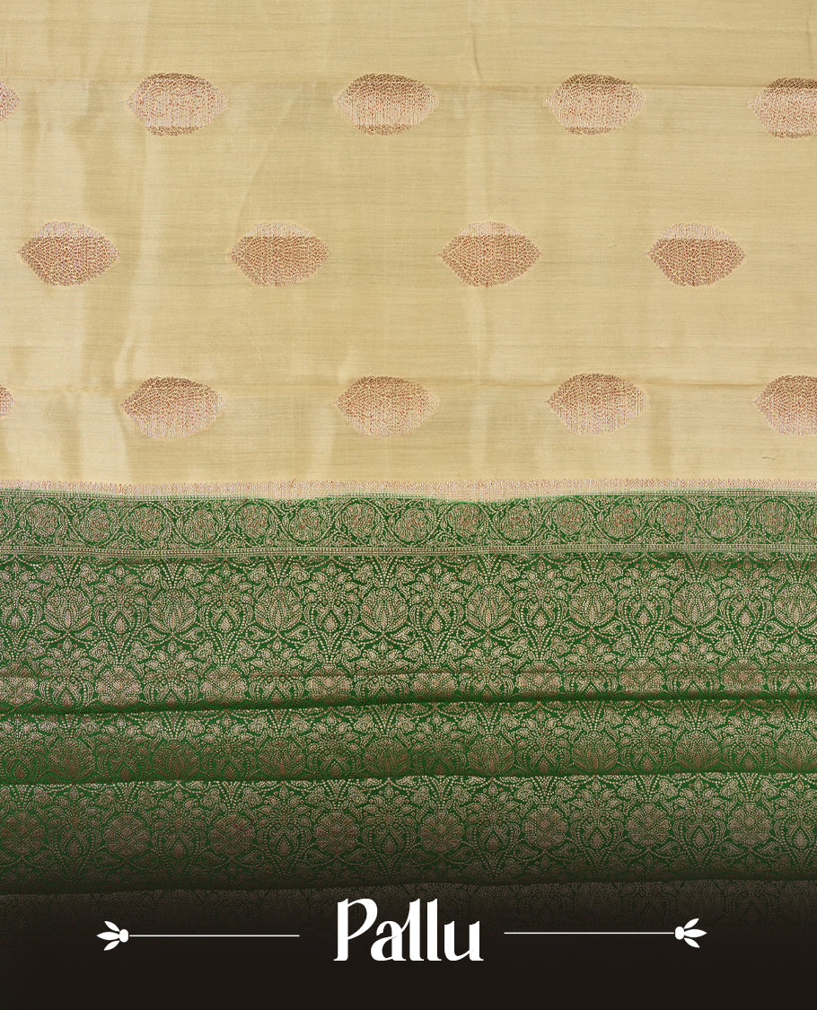 Golden Yellow Colour Banaras Soft Silk Saree with Gold Zari Textured Oval Buttas, Simple Decorative Pallu Border, Pallu with Ornate Floral and Foliate Motifs in Green and Gold Tones, and Matching Forest Green Blouse.