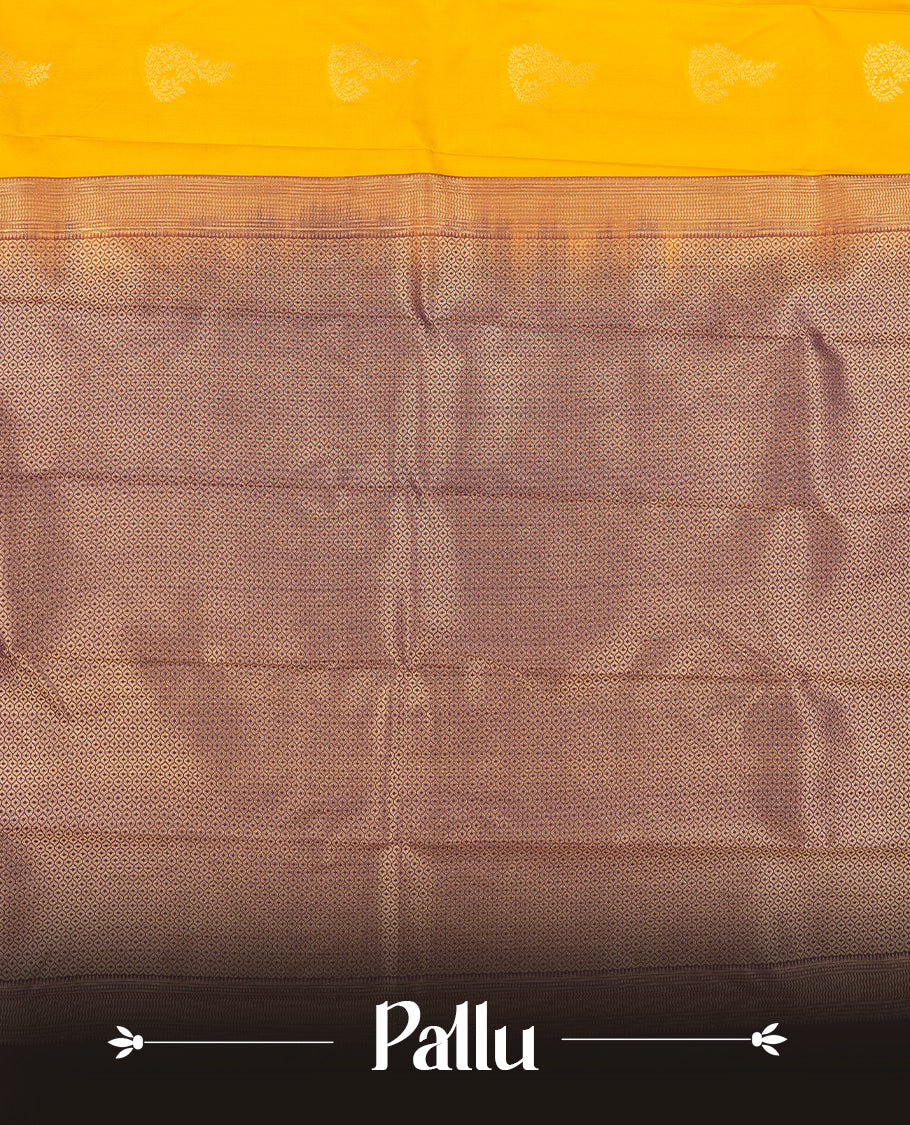 Gold yellow colour Semi Silk Saree with gold zari patterns on the body, paired with a contrasting dark violet colour traditional pallu and border, and a matching blouse piece.