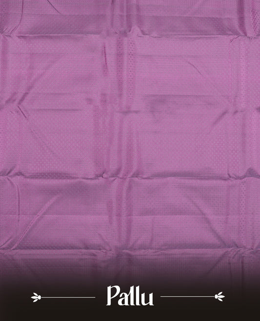 Plum purple colour semi soft silk saree featuring a self coloured textured patterned body, complemented by self coloured pallu & border and a matching blouse piece.