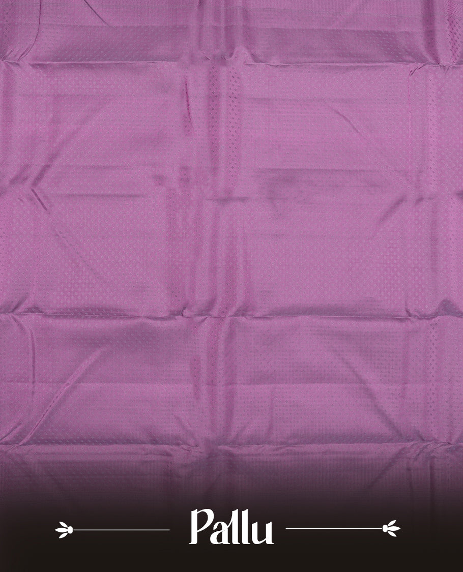 Plum purple colour semi soft silk saree featuring a self coloured textured patterned body, complemented by self coloured pallu & border and a matching blouse piece.