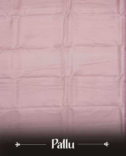 pastel purple colour semi-soft silk saree featuring a self coloured textured patterned body, complemented by self coloured motifs on pallu & border and a matching blouse piece.