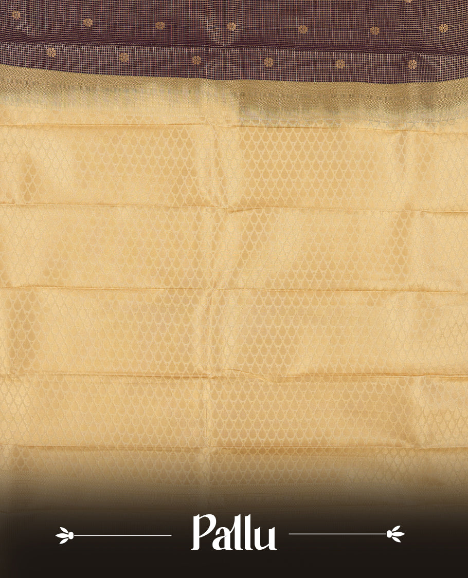 Dark grape colour Semi Silk Saree with golden checks and floral motifs on the body, paired with a contrasting cream pallu and border featuring peacock motifs, and a matching blouse piece