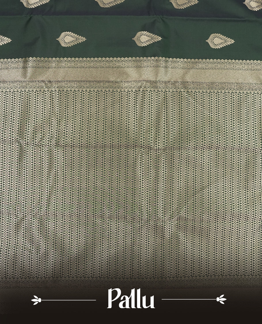 Dark Green colour semi soft silk saree featuring a gold leaf patterned body, complemented by gold traditional pallu & border and a matching blouse piece.