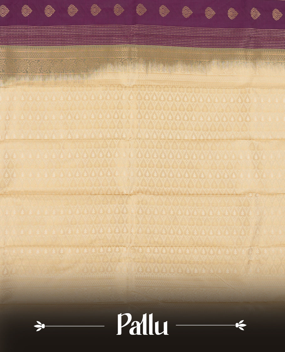 Grape purple colour Semi Silk Saree with gold zari striped patterns on the body, paired with a contrasting cream colour traditional pallu and border, and a matching blouse piece.