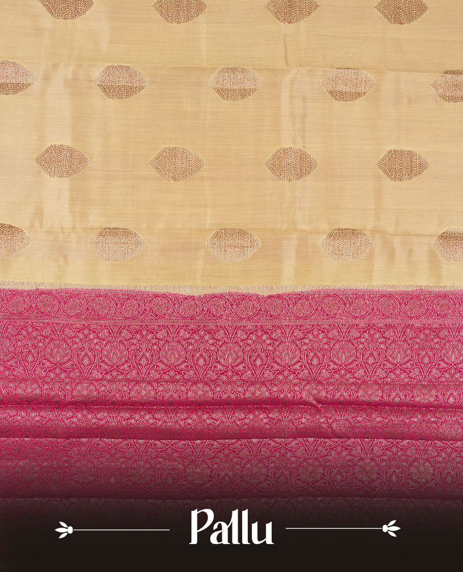 Cream Colour Banaras Soft Silk Saree with Gold and Rose Gold Zari Textured Diamond-Shaped Buttas, Simple Decorative Pallu Border, Grand Pallu with Ornate Floral and Circular Motifs in Magenta and Gold Tones, and Matching Bright Magenta Blouse.