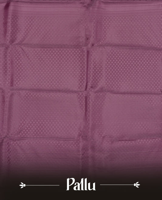 Dark mauve colour semi soft silk saree featuring a self coloured textured patterned body, complemented by self coloured motifes on pallu & border and a matching blouse piece.