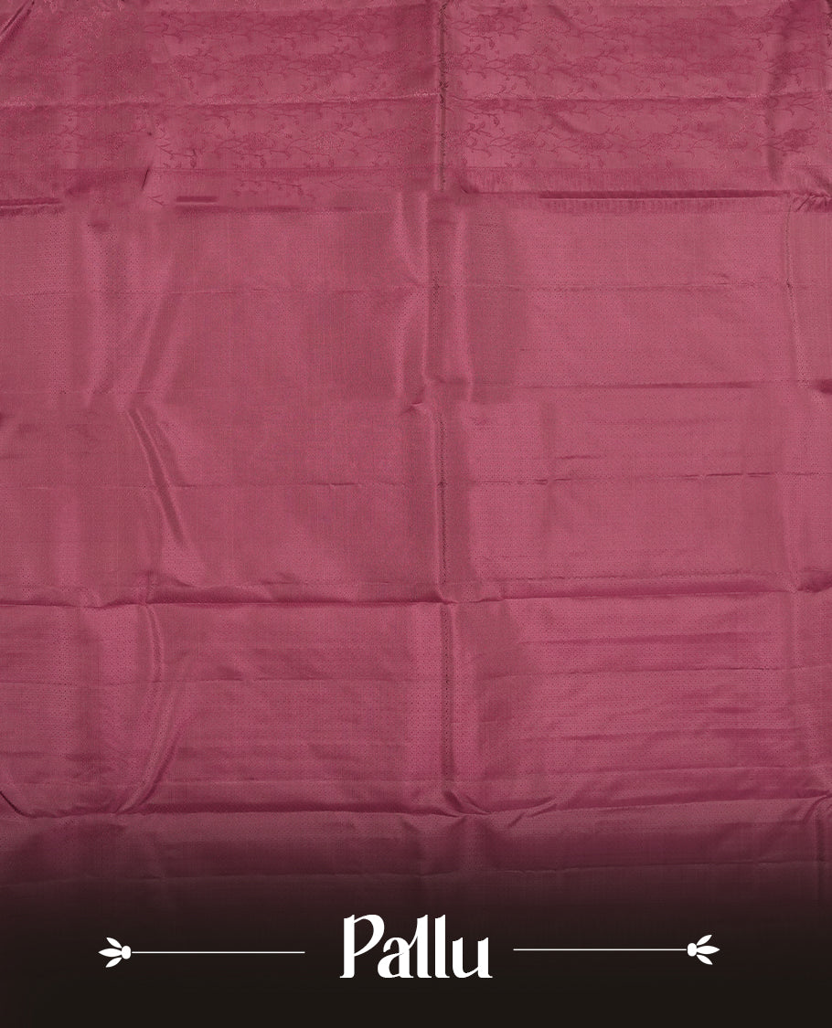 Wine colour semi soft silk saree featuring a self coloured textured patterned body, complemented by self coloured pallu & border and a matching blouse piece.