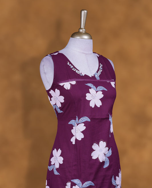 Plum colour coord set sleeveless floral kurta featuring a scoop neckline with subtle bead embellishments, all-over contrast floral print, a straight knee-length silhouette, and side slits for a comfortable, elegant fit.