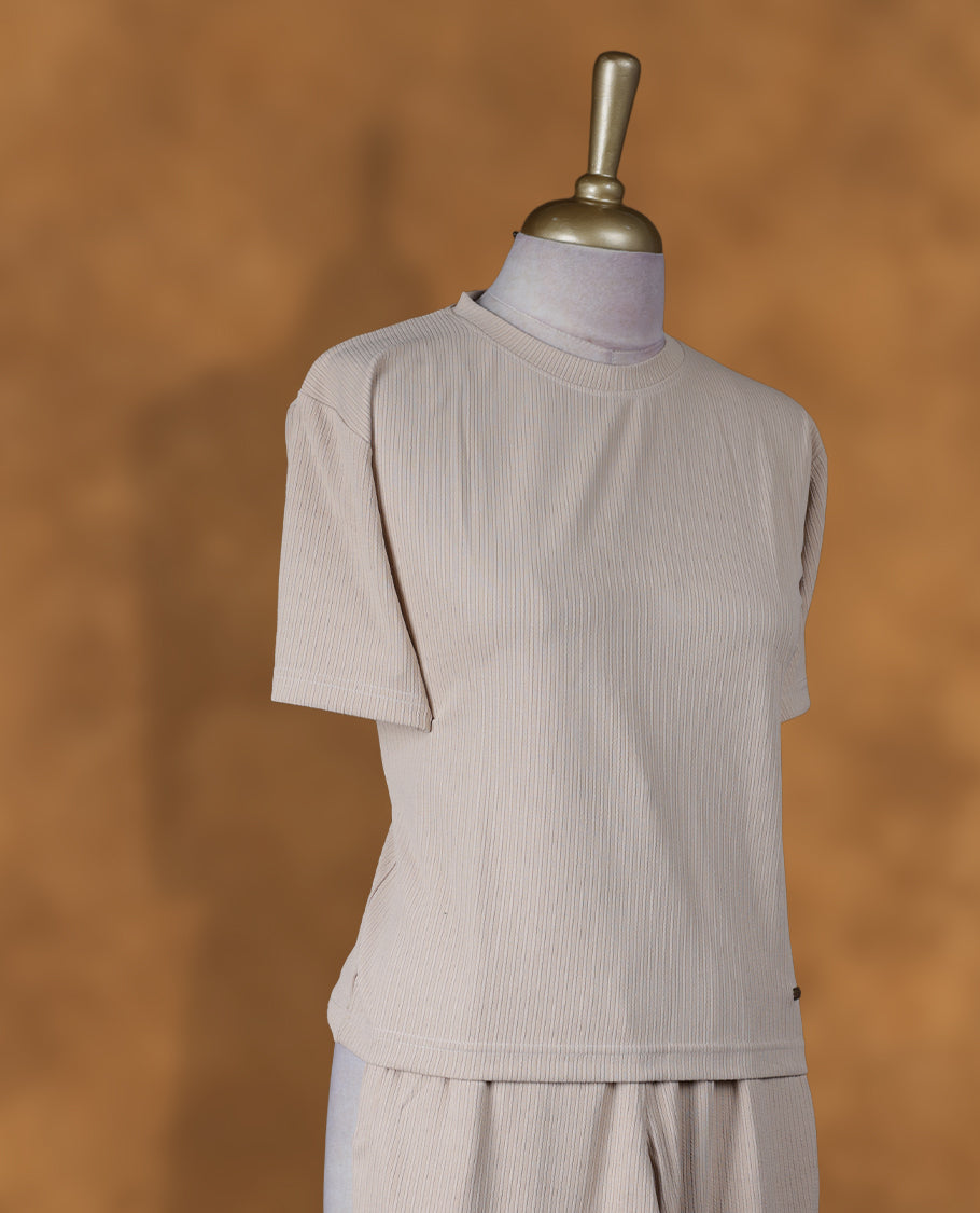 Cream colour coord set styled with a T shirt design with short sleeve, pair a matching bottom pant .