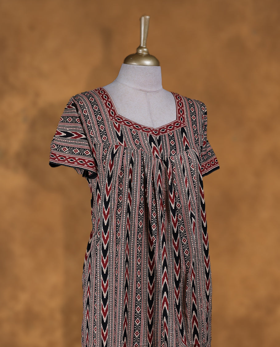 Beige colour NStyle nighty featuring black and red geometric patterns, a Diamond neckline and matching printed border, short sleeves, and a full ankle-length design.