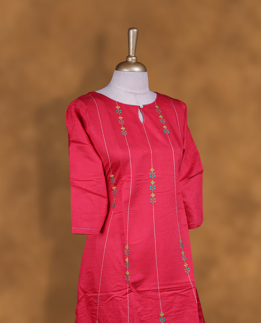 Red colour kurti with styled with a thread pattern around neckline & across body, knee length design, and a sleeve .