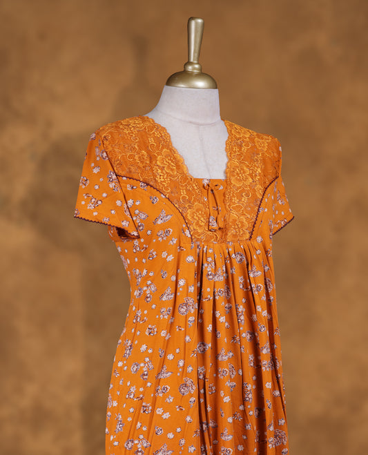 Orange colour NStyle nighty featuring Floral patterns, a Round neckline, short sleeves, and a full ankle-length design.