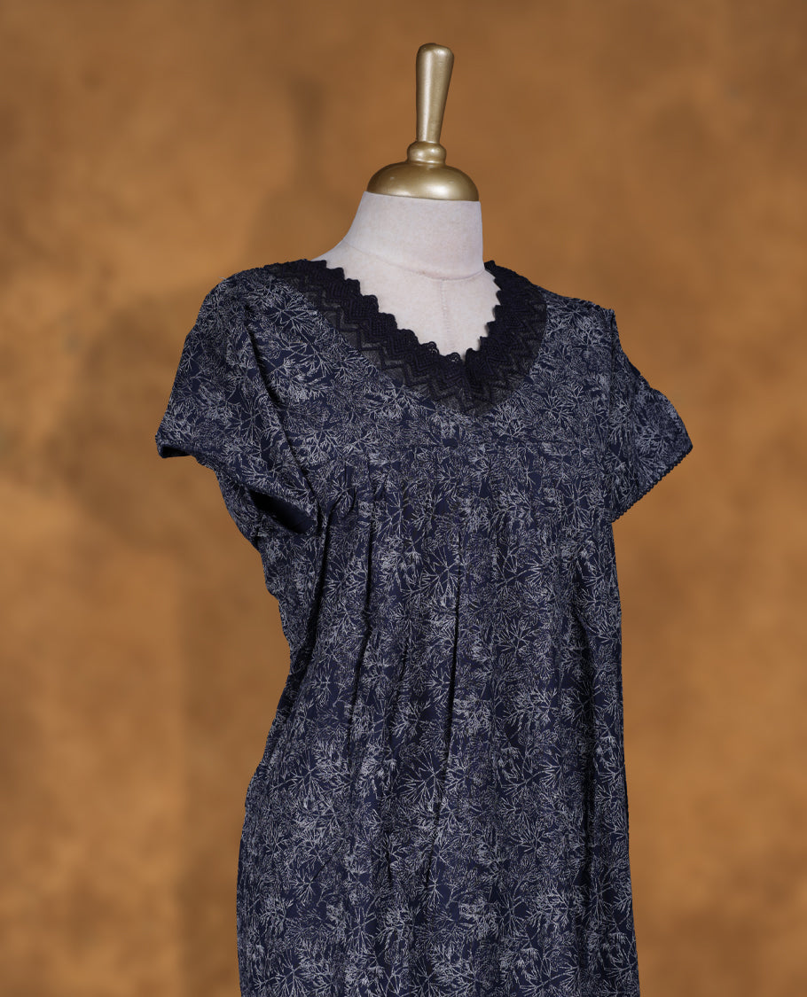 Dark Blue colour Nstyle nighty with featuring a White floaral pattern, a V neckline with lace detailing, Short sleeve, and a full-length