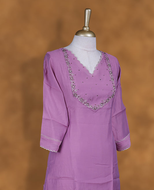 Lavender colour kurti with styled with a thread & beats pattern around neckline & across body, knee length design, and a sleeve .
