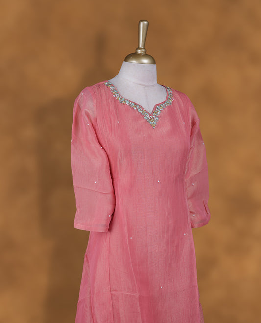 Peach and gold double shade colour kurti with styled with a thread & beats pattern around neckline,  knee length design, and a sleeve .