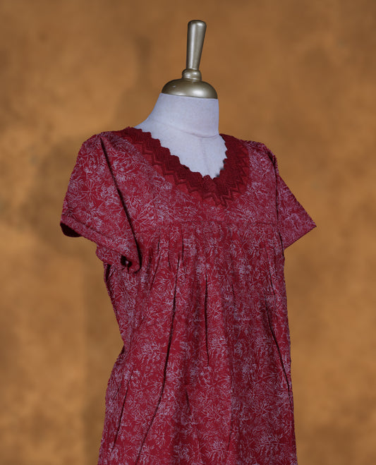 Dark red colour NStyle nighty featuring white floral patterns, a wide V neckline with design lace, short sleeves, and a full ankle-length design.