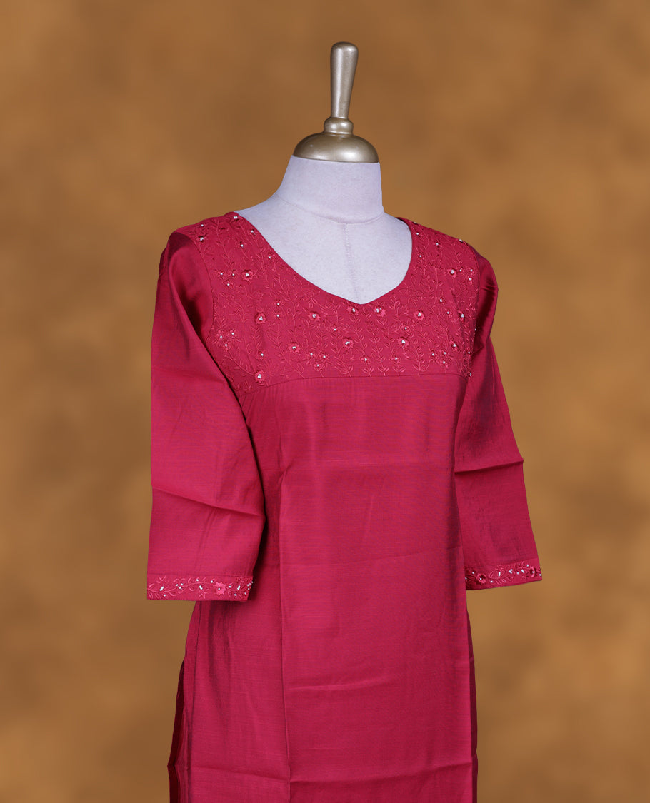 Red colour kurti with styled with a thread & beats pattern around neckline, knee length design, and a sleeve .