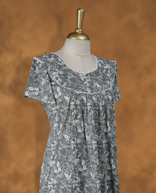 Dark thyme colour NStyle nighty featuring white colour floral patterns, a Diamond neckline with thread details , short sleeves, and a full ankle-length design.