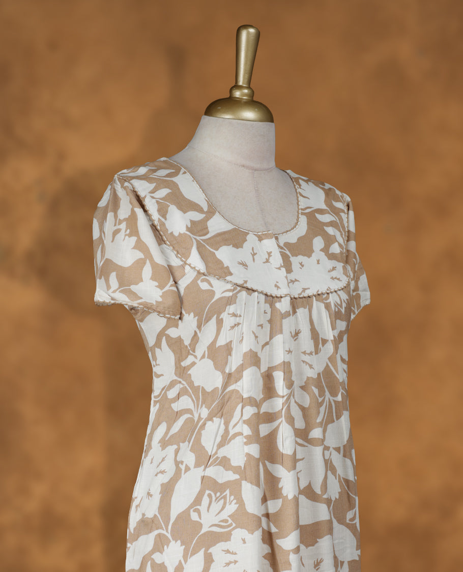 Tanned gold colour NStyle nighty featuring Cream floral patterns, a Round neckline with thread border, short sleeves, and a full ankle-length design.