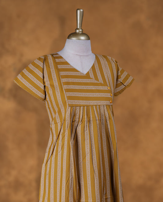 yellowish gold colour NStyle nighty featuring coloured leaf patterns, a V-neckline, short sleeves, and a full ankle-length design.