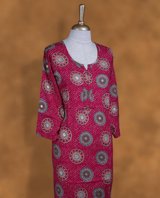 Rani pink colour kurti with styled with a round with v split neckline, print pattern across body knee length design, and a sleeve .