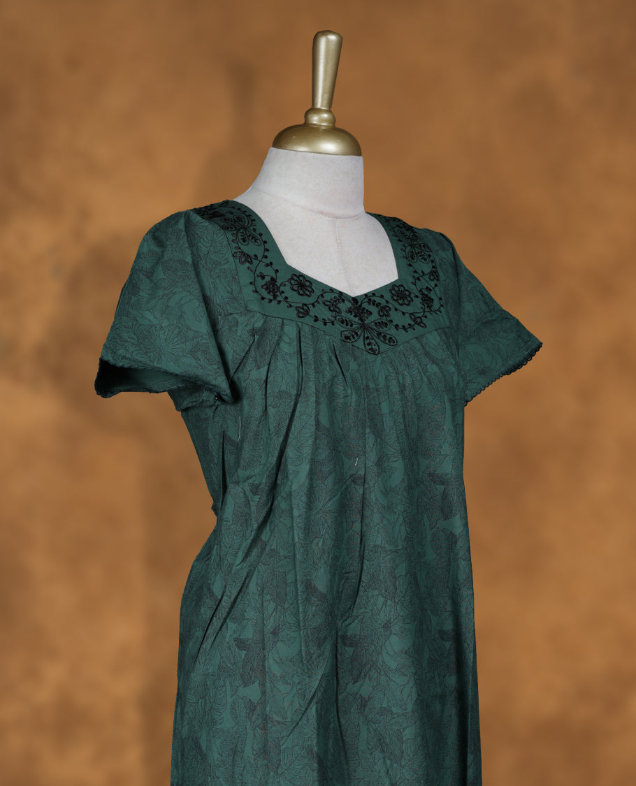 Dark Green colour NStyle nighty featuring black floral patterns, a Diamond neckline with tread design, short sleeves, and a full ankle-length design.