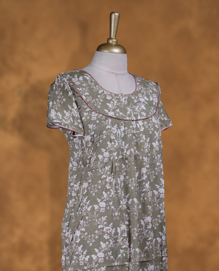 Olive Green colour NStyle nighty featuring white floral patterns, a round neckline with maroon piping detailing, short sleeves, and a full ankle-length design.
