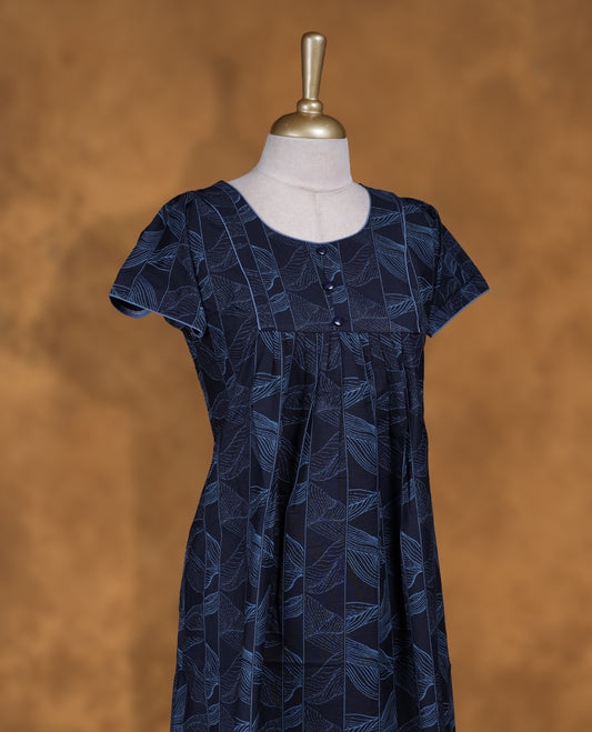 Dark Blue colour Nstyle nighty with featuring a light blue floral pattern, round neckline with light blue lace detailing, Short sleeve, and a full-length