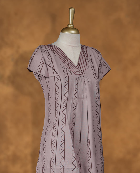 Pastel purple colour NStyle nighty featuring Dark red geometric patterns, a V neckline with dark red theard border, short sleeves, and a full ankle-length design.