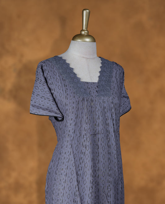 Ash gray colour NStyle nighty featuring black design patterns, a V-cut Neckline with design lace boarder , short sleeves, and a full ankle-length design.